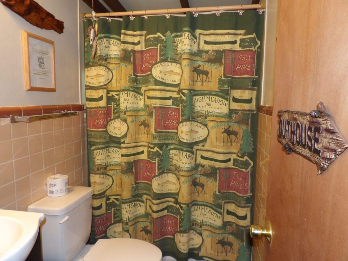 shower with moose-themed curtain