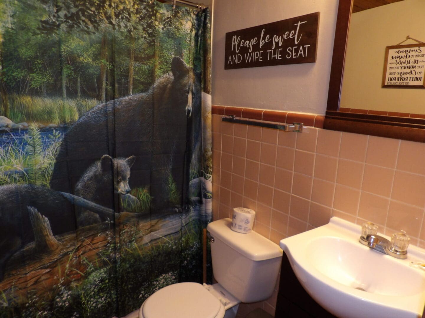 bathroom with bear-themed shower curtain